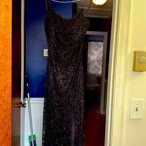 Beautiful black, hand beaded formal gown. Size 4. Only worn once.